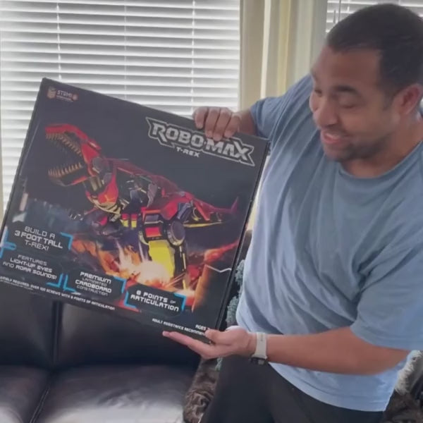 User generated video of man and his nephew assembling the Robo-Max T-Rex toy building set.