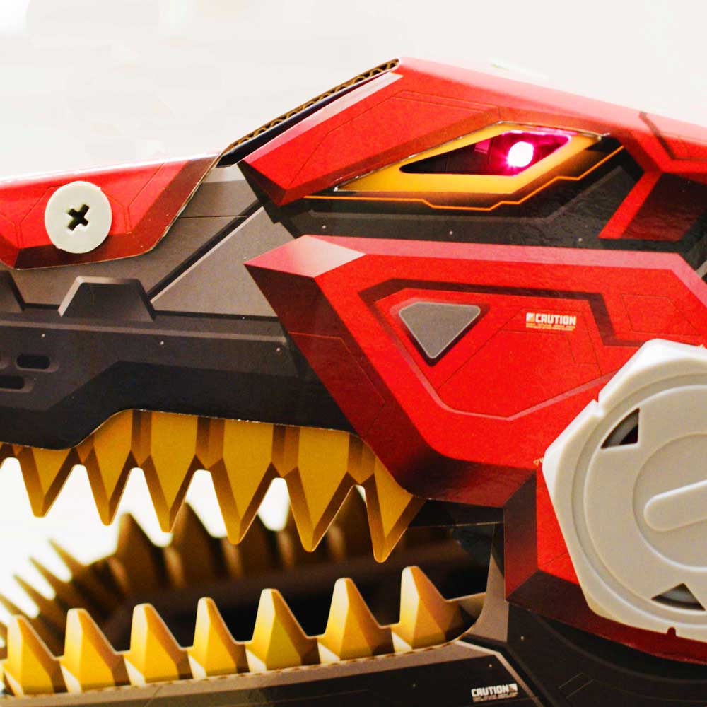 An LED glows bright red inside the eyelet of the Robo-Max T-Rex toy.