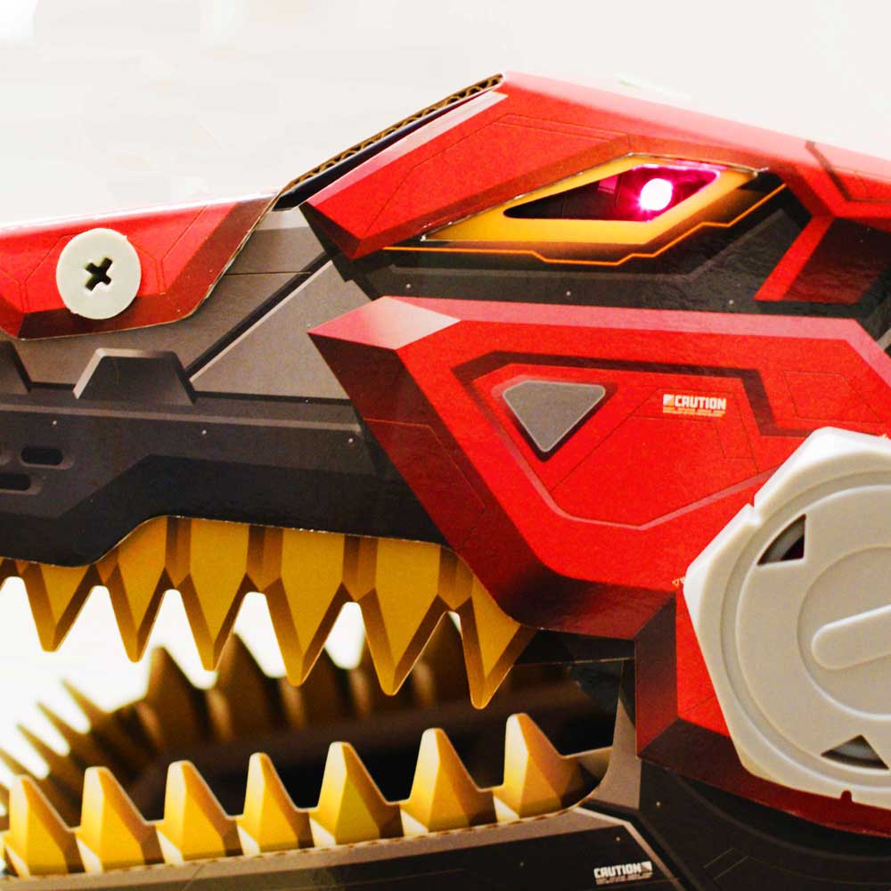 An LED glows bright red inside the eyelet of the Robo-Max T-Rex toy. 